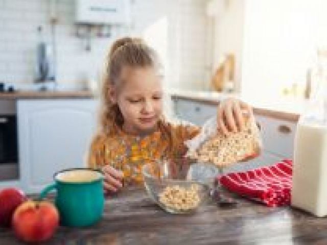 Child pouring cereal