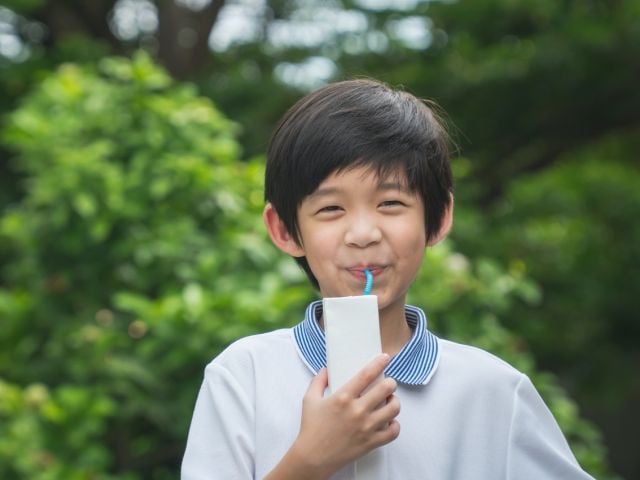 Child drinking from straw