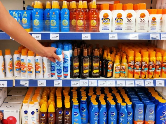 Sunscreens on store shelves.