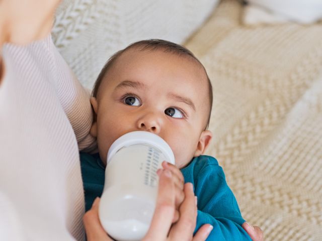 Baby drinking infant formula
