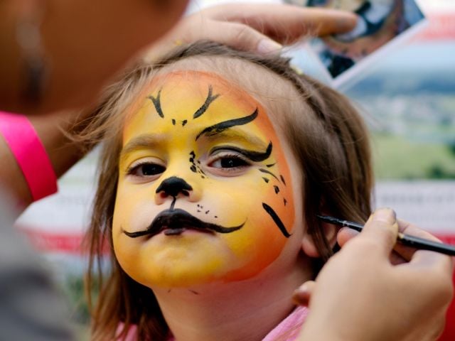 Child with Halloween facepaint on